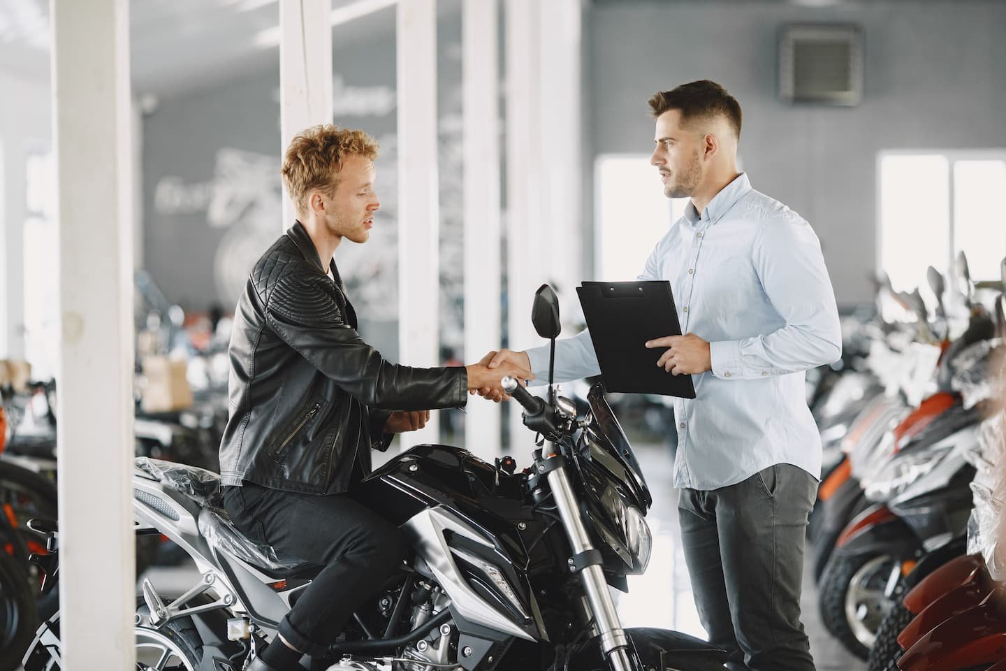 man-choosing-a-motorcycle-to-buy